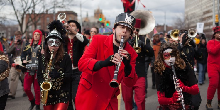 Revelers at the annual parade of Le Nain Rouge (The Red Dwarf). The Ottawa tribe that originally inhabited the region believed it was a protector of the area and the offspring of their stone god. After the french settlement of the area it came to be viewed as a more demonic force and a 'harbinger of doom'.